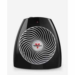 Black whole room heater by Vornado with a silver spiral grill, red logo, and indicator light.