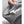 Ice white small nursery heater by Vornado with a person's hand opening its back cord storage compartment revealing a white plug.