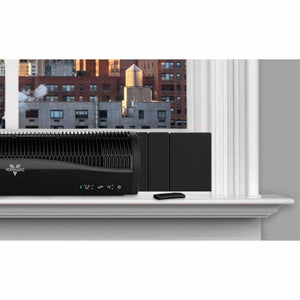 Black window air circulator by Vornado, with a digital '72' display, ribbed grille, and remote control on a sill.