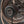 Gunmetal VFAN fan by Vornado, with a bronze grill and 'Vortex Air Flow' and 'VFAN' on the back plate.