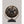 Vintage style fan in gunmetal by Vornado with a round metal cage and black base.