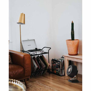 Black vintage whole room heater by Vornado with a circular grill and a metal stand.