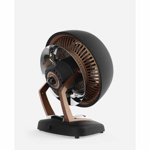 Black and bronze vintage whole room heater by Vornado with a front control dial, on a black base.