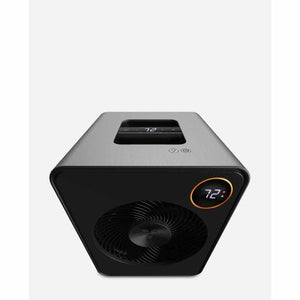 Stainless steel whole room heater by Vornado, with black angular front, central fan grille, and two digital displays showing '72'.