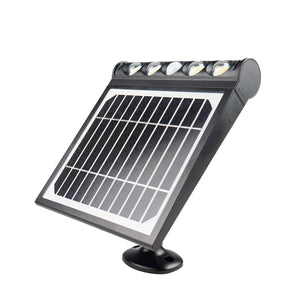 Black solar wall light from Wagan, with five LED bulbs, a rectangular panel, and a round mounting base, angled upwards.