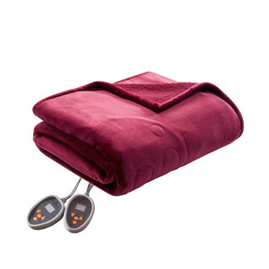 Deep red heated plush to Berber King blanket by Woolrich, folded with two attached digital heating controls.