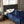 Blue King-size plush heated blanket by Woolrich, featuring a quilted pattern, covering a sleeping woman.